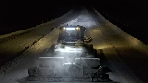 4k. Snow grooming machine on a ski slope at night Stock Footage 161262399