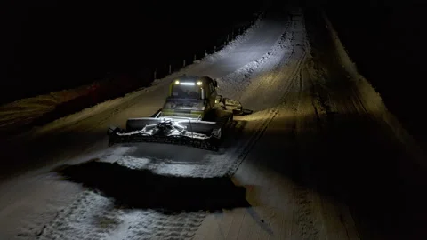 4k. Snow grooming machine on a ski slope at night Stock Footage 161263225
