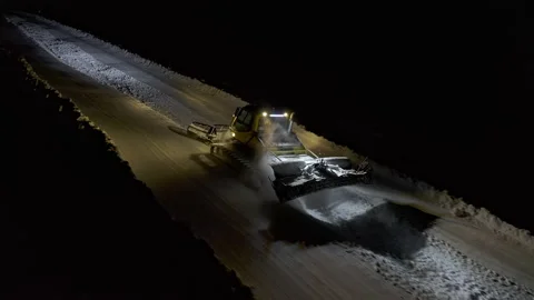 4k. Snow grooming machine on a ski slope at night Stock Footage 161263255
