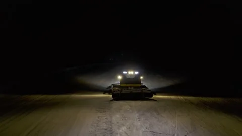 4k. Snow grooming machine on a ski slope at night Stock Footage 161270330