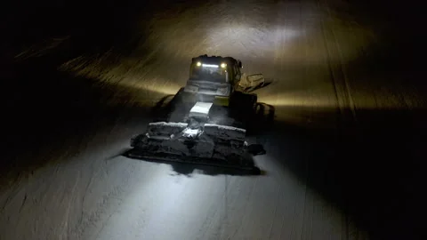 4k. Snow grooming machine on a ski slope at night Stock Footage 161273011