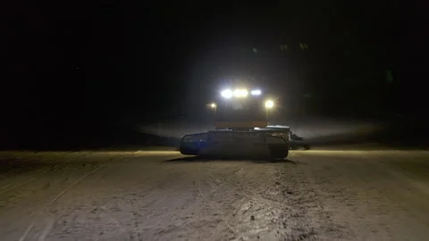 4k. Snow grooming machine on a ski slope at night Stock Footage 161273274