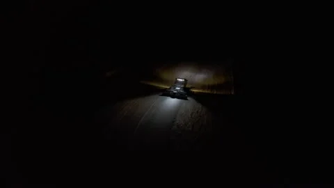 4k. Snow grooming machine on a ski slope at night Stock Footage 161277891