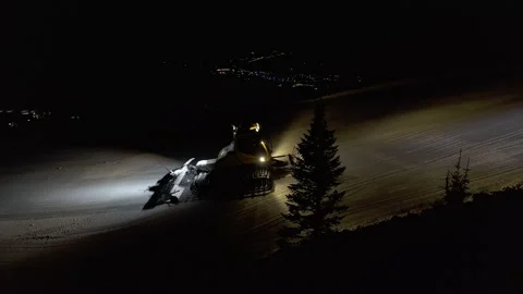 4k. Snow grooming machine on a ski slope at night Stock Footage 161279019