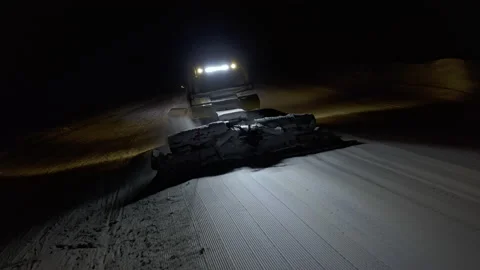 4k. Snow grooming machine on a ski slope at night Stock Footage 161279509