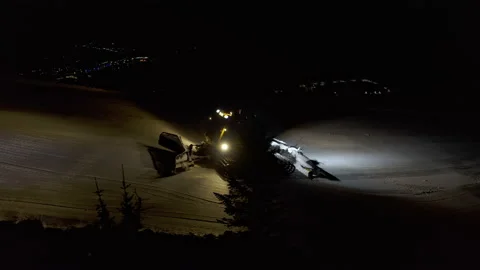 4k. Snow grooming machine on a ski slope at night Stock Footage 161279724