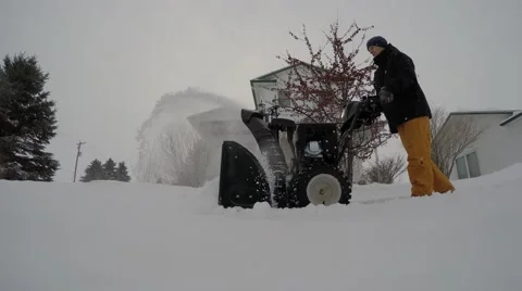 4k snowblower side view down low Stock Footage 46502748