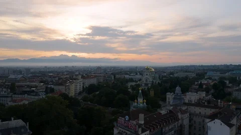 4K Sofia Bulgaria Reverse Aerial at Dawn Sunrise Cathedral in Background Stock Footage 122461990