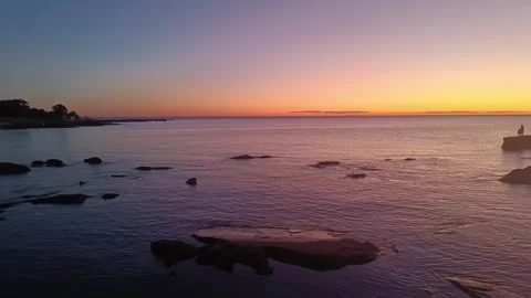 4K Soft Blurred Sunset Over Calm Ocean - Soft Handheld Motion 30s Stock Footage 321304108