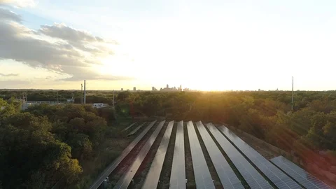 4K Solar Panel Clean Energy Reveal Austin in Background Sunset Stock Footage 94594352