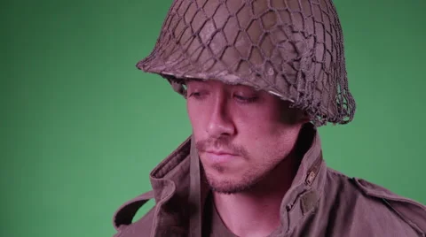 4K A soldier throws a gun over his shoulder Video stock 45734135