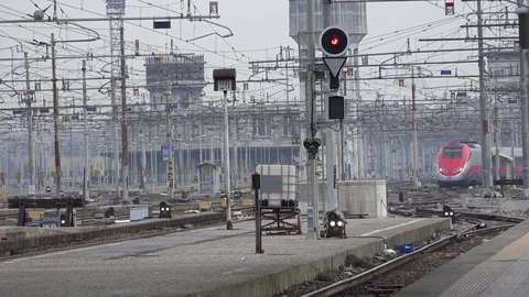 4K Speed train arrive in Milan central station railway transportation commuter Stock Footage 74003298