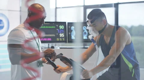 4K Sports professional analyzing man's fitness levels with hi tech equipment Stock Footage