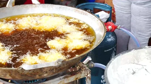4K spring roll and all deep fried in pan with hot oil at chinese restaurant i Stock Footage 68342126