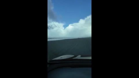 4K stabilized footage from the driver's perspective of driving on sand beach USA 스톡 동영상 328986117