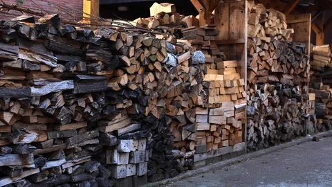 [4k] stack of wood in german housing estate Stock Footage 128298694