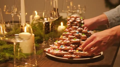 4K Star Shaped Gingerbread Cookie Tree Centerpiece Holiday Table Stock Footage 334442133