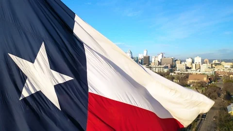 4K State Flag of Texas Drone Footage Austin Skyline Drone Flying USA Stock Footage 124077666