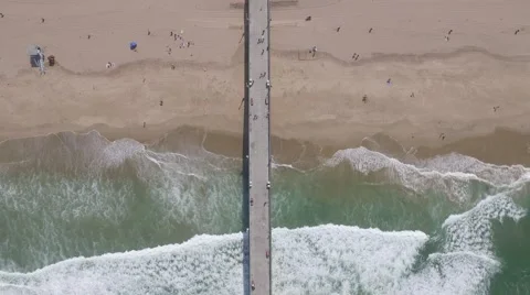 4K static aerial shot looking down on Manhattan Beach pier in Los Angeles, CA Stock Footage 64657129