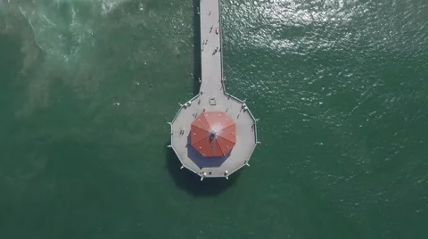 4K static aerial shot looking down on Manhattan Beach pier in Los Angeles, CA Stock Footage 64657417
