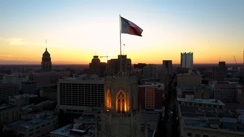 4K Static Drone Footage Texas State Flag Sunset San Antonio Skyline Stock Footage 119729942