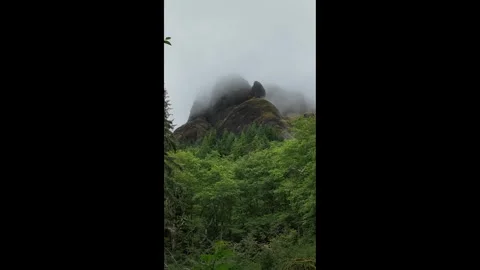 4K static footage of low clouds and fog drifting across the rocky cliffs in USA Stock Footage 337867746