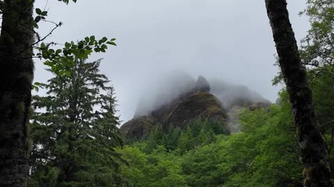 4K static footage of low clouds and fog drifting across the rocky cliffs in USA Stock Footage 337867761