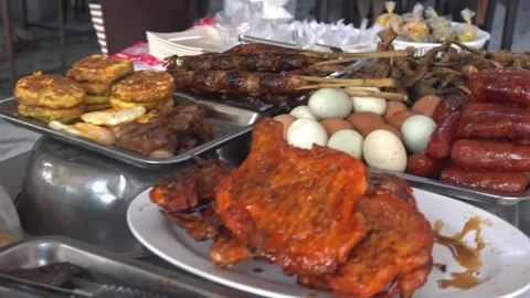 4K Static Medium Shot Khmer Street Food Display Chicken Sausages Eggs Cambod Stock Footage 348620270