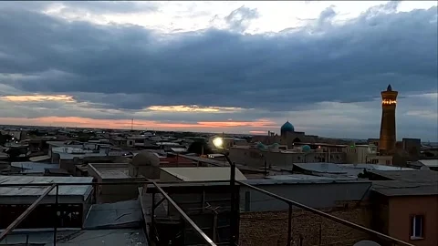 4K static shot of dramatic twilight sky and rooftop lantern in Uzbekistan Stock Footage 335834894