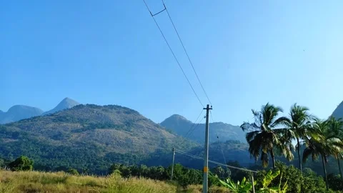 4K Static Shot of Nelliyampathy Hills and Blue Sky in Cherapuram near Kolle.. Stock Footage 329557604