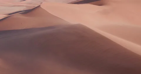 4K static shot of sand blowing over the sand dunes in Namibia Video stock 64697149