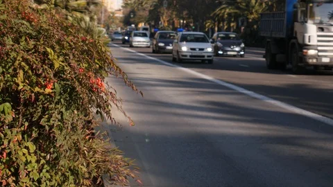 4k static shot selective focus of cars and buses passing by on a 4 way street Stock Footage 123421913