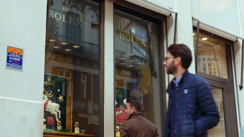 4k static shot of a young man watching the window display of a jewellery. Stock Footage 122812697
