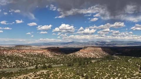 4K Static Timelapse of Rippling Light Waves Over Desert Mesas and Rain Clouds Stock Footage 335921071