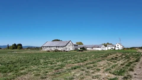 4K steady video of old partly abandoned farm buildings &amp;amp; barns on Sauvie Isl 動画素材 318636768