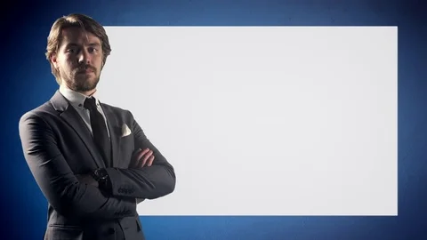 4K Stern Looking Business Man Portrait Blue Background Crossed Arms Unsmiling Stock Footage 80904540