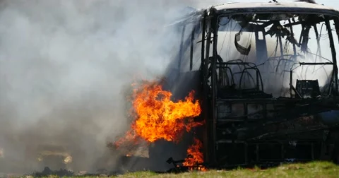 4K Stock Footage Exploded Bus Burns Stock Footage 55857745