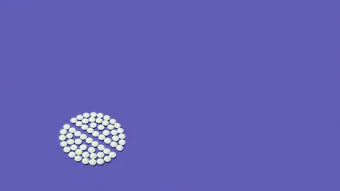 4K Stop motion animation loop of white pill on Veri Pery background Stock Footage 169065769