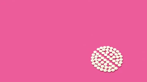 4K Stop motion animation loop of white pill on Pacific Pink background Stock Footage 169364809