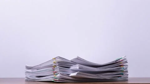 4K Stop of motion close-up stack overload document report paper Video stock 139074547