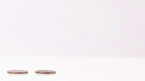 4k stop motion five piles of gold money coins decreasing Stock Footage 153944624