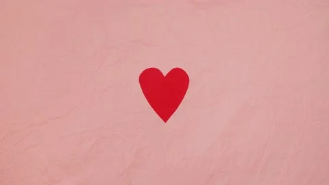 4K stop motion video of heart beating concept. Red paper heart on the pink backg Stock Footage 146183180