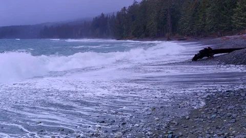 4K Storm Waves Crash onto Beach, White Wave Froth, Rock Pebble Beach Stock Footage 72335586