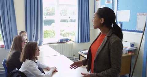 4k, students in class with their arm raised to answer a question. Stock Footage 77285133