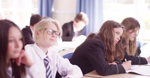 4k, Students in a classroom raising hands together Stock Footage 62970083