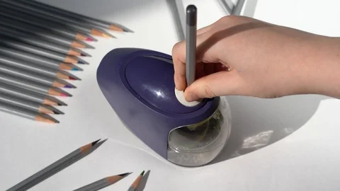 4K. a student's Hand sharpens a wooden pencil . Stock Footage 129516121
