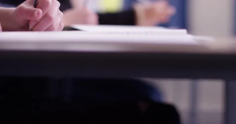 4k, Students in school uniform taking exam at desk in a classroom. Slow motion. Stock Footage 63018693