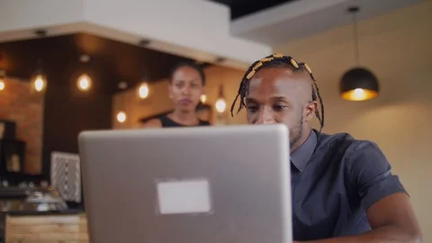 4k students using laptop in the coffee shop studying together. Stockbeeldmateriaal 111331339