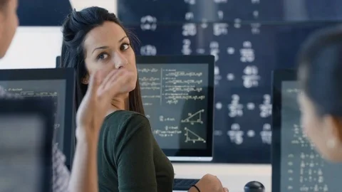 4K Students working on computers &amp; chatting in adult education math class Stock Footage 73178628