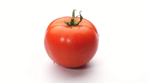 4K Studio Shot of a Fresh Red Tomato with Water Drops on a White Background. Stock Footage 316953281